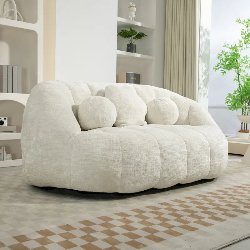 Fauteuil lounge blanc de 63.78, rembourré de chenille et doté de mousse haute densité