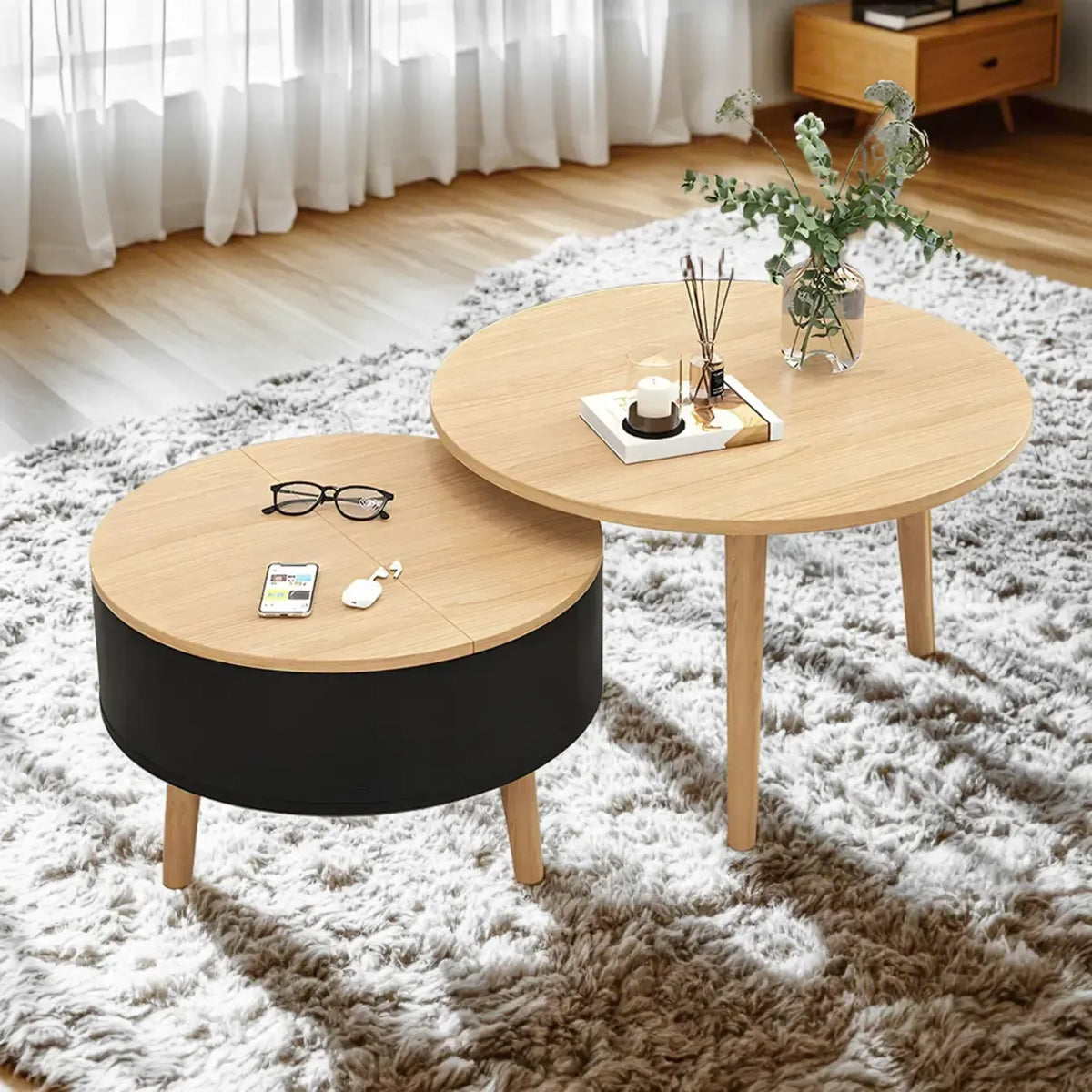 Moderner runder Couchtisch aus Holz in Schwarz und Weiß mit Stauraum