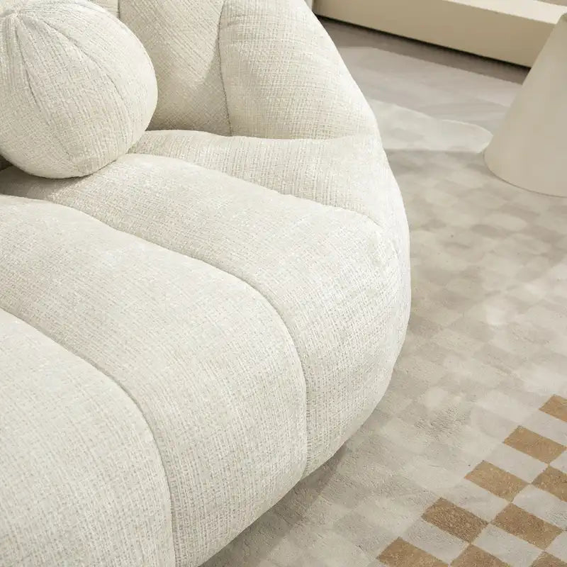 Fauteuil lounge blanc de 63.78, rembourré de chenille et doté de mousse haute densité